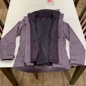 Like new, Under Armour lady’s S purple Storm jacket Cold Gear. With hood.